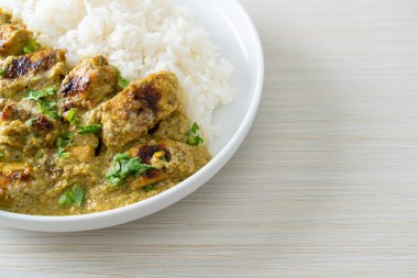 Afghani chicken in green curry or Hariyali tikka chicken hara masala with rice - Asian food style