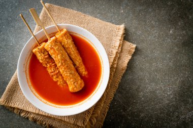 Omuk - Korean fish cake skewer in Korean spicy soup - Korean street food style clipart