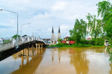 Cathedral of the Immaculate Conception with Niramon bridge and river at Chanthaburi in Thailand