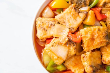 fish stew with tomato and pepper on plate