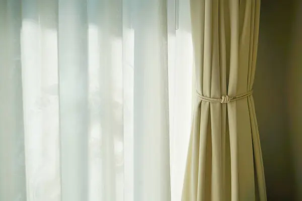 beautiful curtain with window and sunlight
