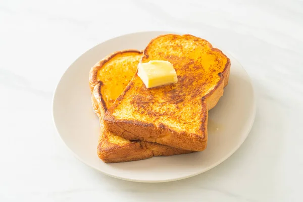 French toasted with butter and honey for breakfast