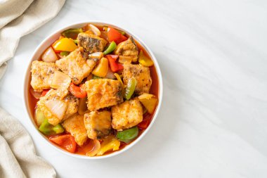 fish stew with tomato and pepper on plate