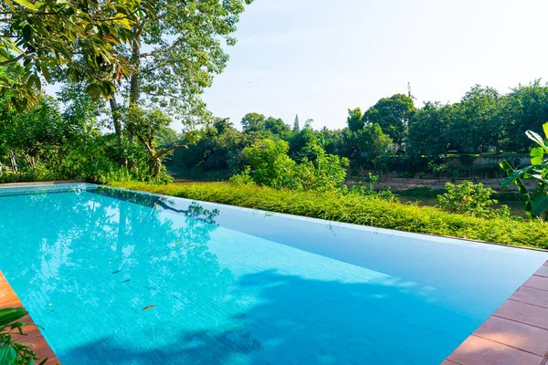 swimming pool in the garden with river view