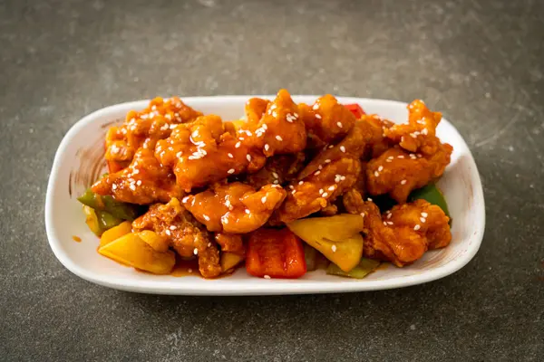 fried crispy chicken with sweet and sour sauce in Korean style