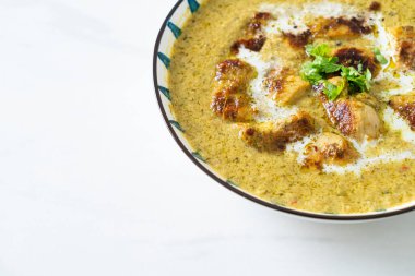 Afghani chicken in green curry or Hariyali tikka chicken hara masala - Indian food style