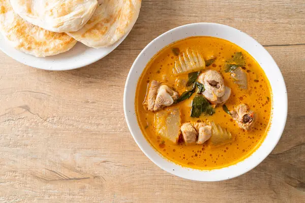 Chicken curry soup with roti or naan with chicken tikka masala - Asian food style