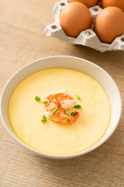 Steamed egg with shrimp and spring onions on top
