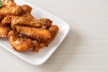 Fried Snapper Belly on white plate - Asian food style
