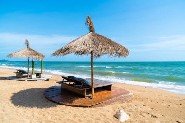 beach chair and umbrella with sea beach background - Holidays and vacation concept