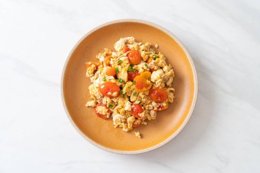 stir-fried tomatoes with egg on plate - healthy food style