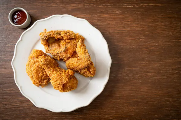 fried chicken with ketchup on plate - unhealthy food