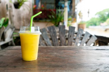 mango smoothies in plastic take away glass
