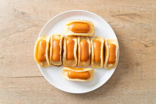 homemade flat pancake roll with sausage