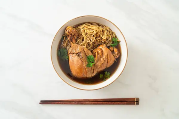 Noodles with Braised Chicken in Brown Soup Bowl - Asian food style