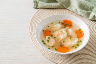 shrimp dumpling soup in white bowl - Asian food style