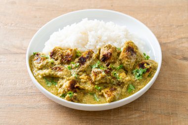 Afghani chicken in green curry or Hariyali tikka chicken hara masala with rice - Asian food style