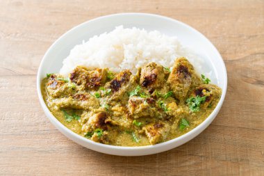 Afghani chicken in green curry or Hariyali tikka chicken hara masala with rice - Asian food style clipart
