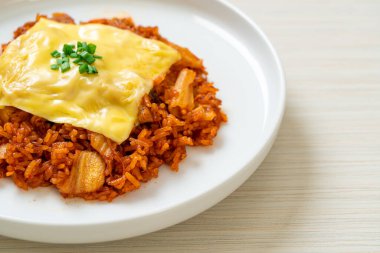 kimchi fried rice with pork and topped cheese - Asian and fusion food style clipart