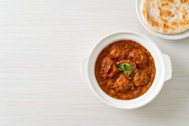 chicken tikka masala spicy curry meat food with roti or naan bread - Indian food style