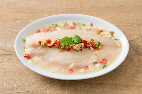 stock image Steamed Fish in Spicy Lemon Sauce on white plate