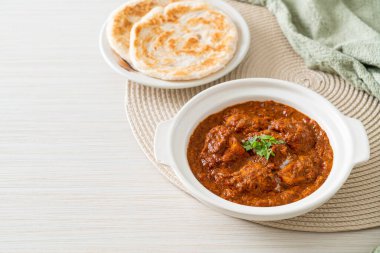 chicken tikka masala spicy curry meat food with roti or naan bread - Indian food style