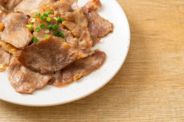 stock image grilled pork neck sliced on plate in Asian style