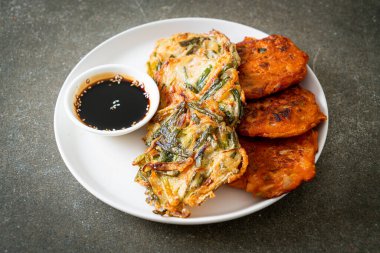 Pajeon or Korean pancake and Korean Kimchi pancake or Kimchijeon - Korean traditional food style clipart