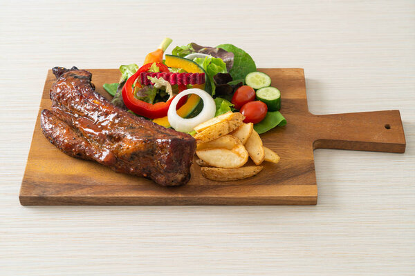 grill barbecue pork spare ribs with vegetables