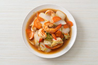 stir-fried Chinese cabbage with shrimps on plate clipart