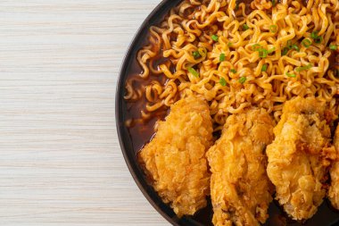 Korean instant noodles with fried chicken or Fried chicken ramyeon - Korean food style clipart