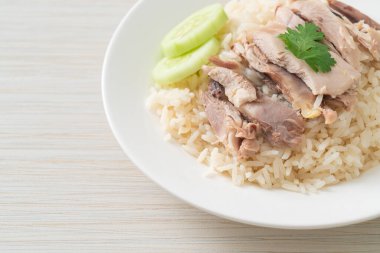 Hainanese Chicken Rice or steamed rice with chicken - Asian food style clipart