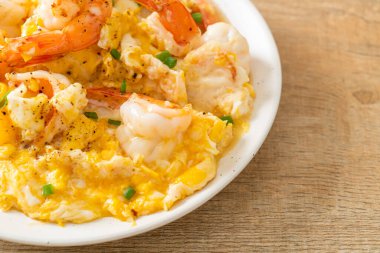 homemade creamy omelet with shrimps or scrambled eggs and shrimps clipart