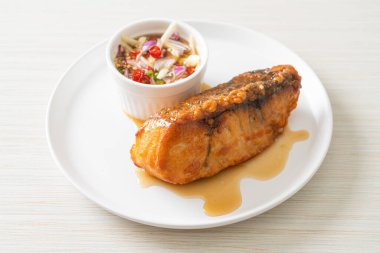 fried snapper fish with fish sauce and spicy salad - Asian food style