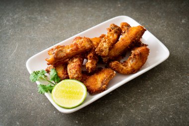 Fried Snapper Belly on white plate - Asian food style