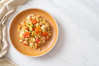 stir-fried tomatoes with egg on plate - healthy food style