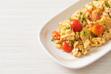 stir-fried tomatoes with egg on plate - healthy food style