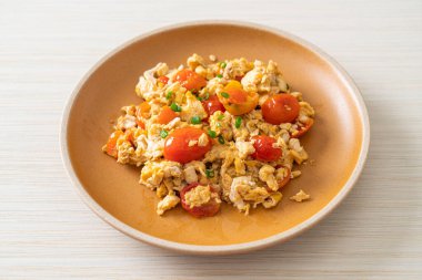 stir-fried tomatoes with egg on plate - healthy food style