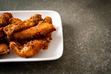 Fried Snapper Belly on white plate - Asian food style