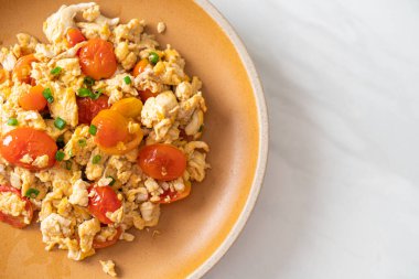 stir-fried tomatoes with egg on plate - healthy food style