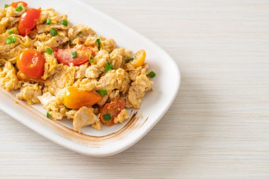 stir-fried tomatoes with egg on plate - healthy food style