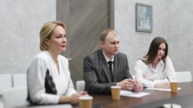 Business meeting in modern office, successful managers discussing project, sharing ideas. Colleagues working together, planning strategy. Concept of business