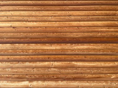 Kahverengi ahşap yapısı doğal ağaçtan geliyor. Tahta panelin güzel koyu bir deseni var, sert ahşap ön cephe dokusu.