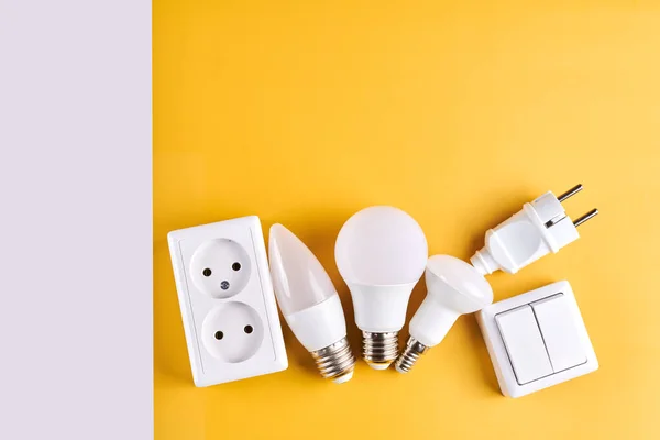 Electric light set with dimmer switch, controllable lighting. Saving energy concept, device designed to change electrical power isolated on white yellow background