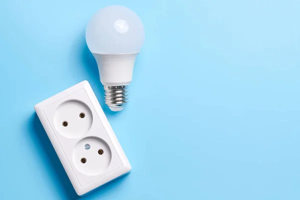 Electric light set with dimmer switch, controllable lighting. Saving energy concept, device designed to change electrical power isolated on blue background