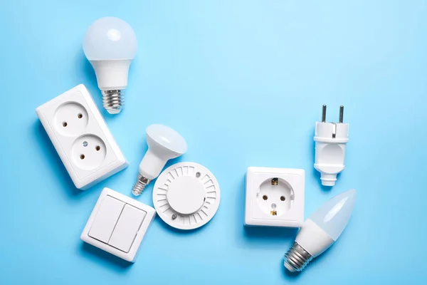 Electric light set with dimmer switch, controllable lighting. Saving energy concept, device designed to change electrical power isolated on blue background