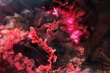 Red black abstract ocean background. Splashes and waves of paint under water, clouds of smoke in motion