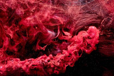 Red abstract ocean background. Splashes and waves of paint under water, clouds of smoke in motion.