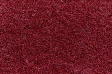 Soft felt textile material red pink colors, colorful texture flap fabric background closeup