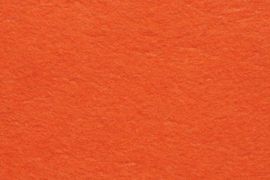 Soft felt textile material bright orange colors, colorful texture flap fabric background closeup